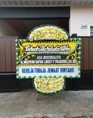 Papan Bunga Duka di Firiwage